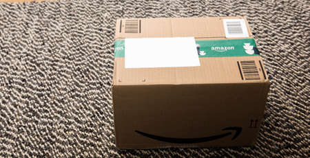 Amazon Prime cardbox on wooden floorのeditorial素材