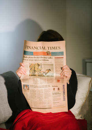 Financial Times newspaper with the cover headline Scholz plans fresh Ukraine talks as west steps up evacuations as German leader meet Putinのeditorial素材