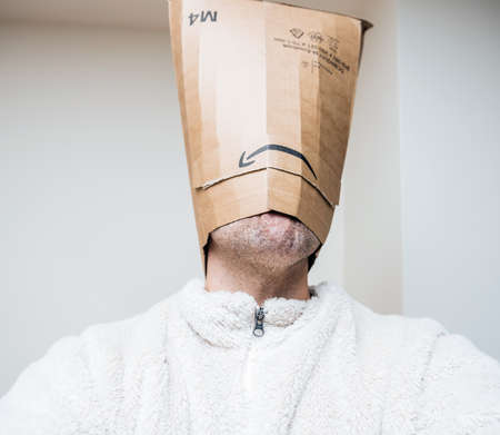 Front view of male with Amazon Cardboard parcel instead of headのeditorial素材