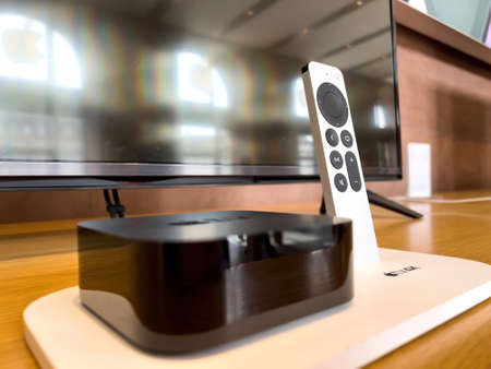 Apple TV 4k digital media player and microconsole that is developed and marketed by Apple Inc with Siri remoteのeditorial素材