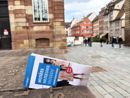 Map of al museum of Strasbourg city left on the stone pavement - pedestrians in backgroundのeditorial素材