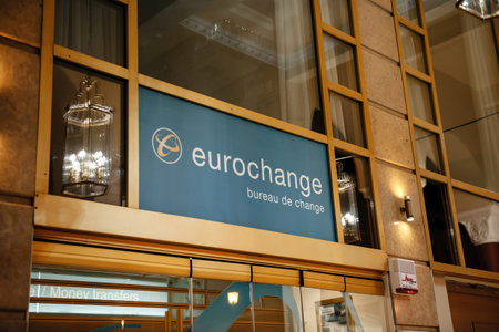 Eurochange - bureau de change signage above the entrance in Pl. Aristotelous 9 modern and fast money currency exchange serviceのeditorial素材