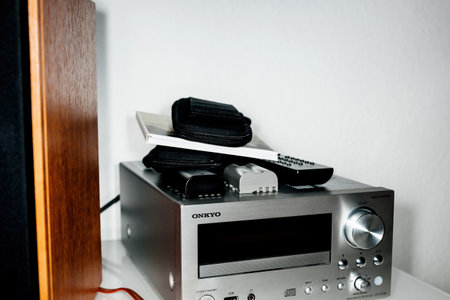 Onkyo CR-N755 Silver with multiple remote controls and Camera photo batteriesのeditorial素材