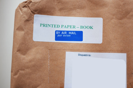 Printed paper book by air mail par avion sticker on the cardboard box paperの写真素材