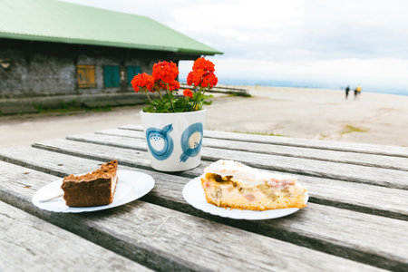 Delicious german pastries kuchen with gardenia flower as seen on