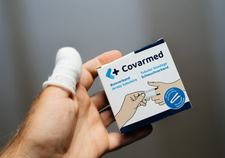 POV male hand close-up holding package with Covarmed jersey tubulare with applicator