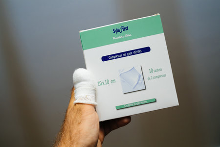Doctor holding Syla First Sterile gauze compresses - superior qualityのeditorial素材