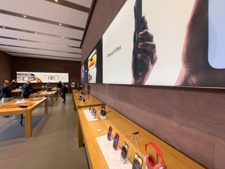 POV male hand holding new purple colored Apple Computers iPhoneのeditorial素材