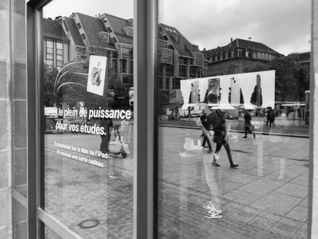Apple Store interior reflected with customers waiting inside toのeditorial素材