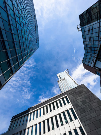 Low angle view of tall skyscrapers in modern financial city centの写真素材