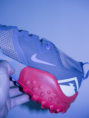 POV male hand holding red package of Nike Wildhorse 7のeditorial素材