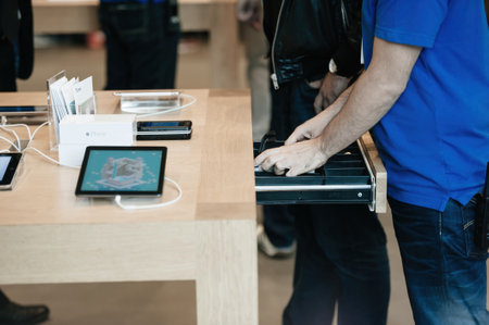 Apple Store interior genius worker employee ranging money in casのeditorial素材