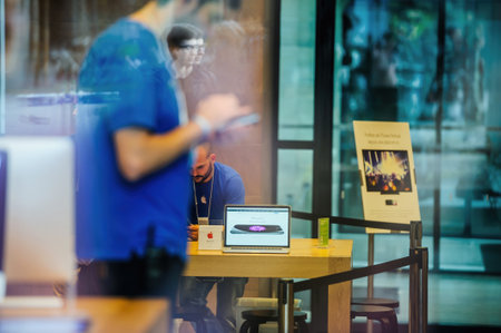 Street view of busy Apple Computers Store interior with Apple Coのeditorial素材