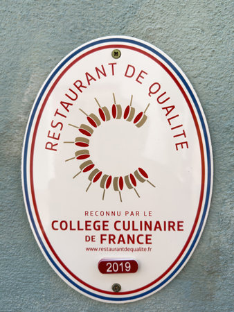 Signage at the entrance of restaurant - restaurant de qualite recognized by the College Culinaire de Franceのeditorial素材