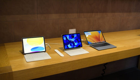 Apple store showcase with new iPad redesigned model, ipad Pro and macBook pro laptop