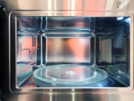 Interior of an empty modern microwave ovenの写真素材