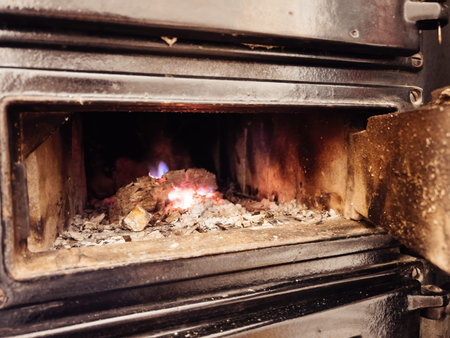 Fire in metal stove - macro close-up open air-duct