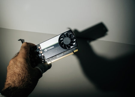 engineer holding in dark server room new NVIDIA T600 video card with NVIDIA Turing GPU cores enabling professionals to tackle multi-app workflowsのeditorial素材