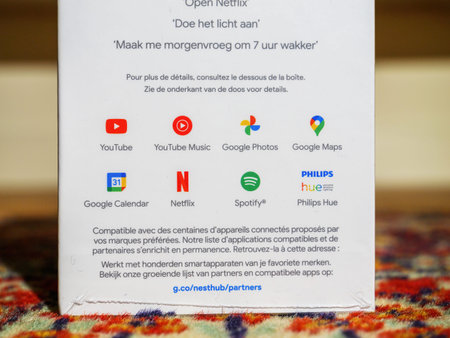 Close-up of new Google Nest Hub with Hey google service - person