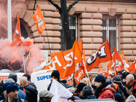 Smoke grenade in woman hands at second demonstration against the new pension reform to be presented next month by French Prime Minister Elisabeth Borneのeditorial素材