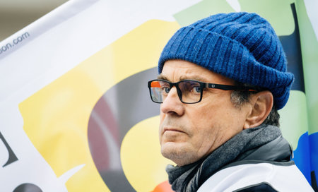 Portrait of a French man with CD eyewear at second demonstration against the new pension reform to be presented next month by French Prime Minister Elisabeth Borneのeditorial素材