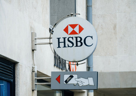 HSBC bank logotype insignia above branch headquarter entranceのeditorial素材