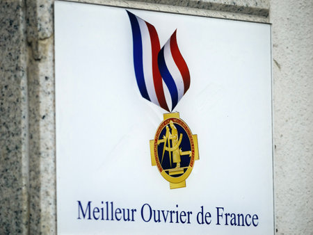 Badge in front of a hair saloon iin France - Meilleur Ouvrier deのeditorial素材