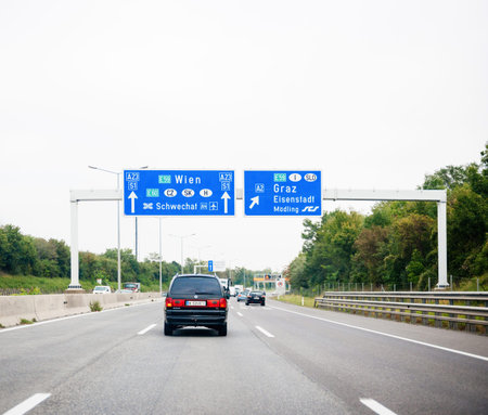 View from the highway at the blue direction signs above with Wie