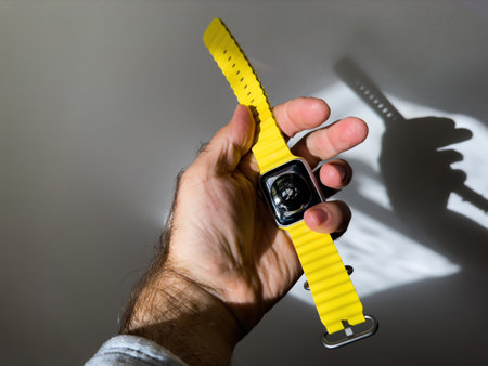 holding new titanium Apple Watch Ultra designed extreme enduranceのeditorial素材