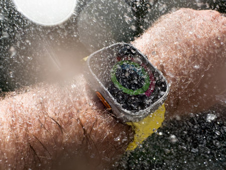 Closed all activity circles - Underwater diving Male hand swimming with new titanium Apple Watch Ultra designed for extreme activities like endurance sports water drops on the oled displayのeditorial素材