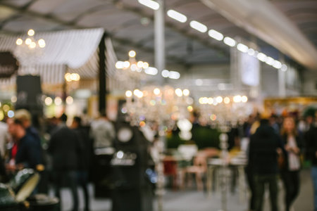 Defocused view of people visiting a fairの写真素材