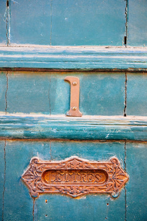 Old rusty number 1 sign on the vintage old door unique Letters sign translated as for mails signage on the wooden blue door in South of Franceの写真素材