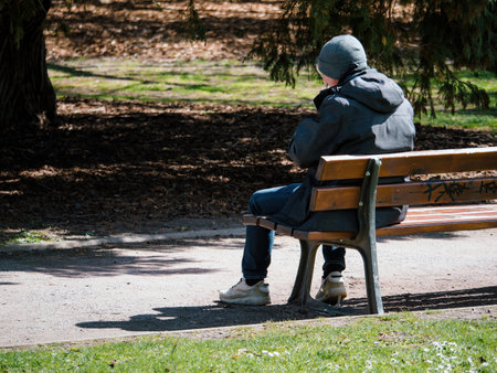 Senior Man Enjoying Park View From Benchの写真素材