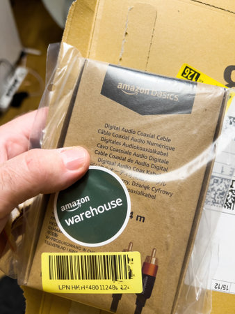 New Audio Cable in Mans Hand - Warehouse Deals.のeditorial素材