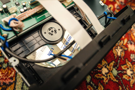 View of a Super Audio CD DSD compact disc hybrid Die Walkure by Richaard Wagner - Circuit board of a hi-fi audio system repair - capacitors and transistorsのeditorial素材