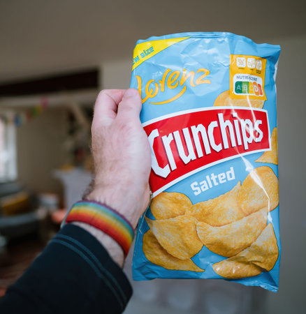 Man Enjoying a Handful of Salty Crunchips