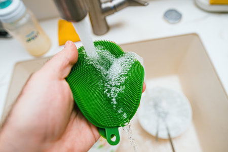 Eco-Friendly Cleaning: a Handy Green Spongeの写真素材