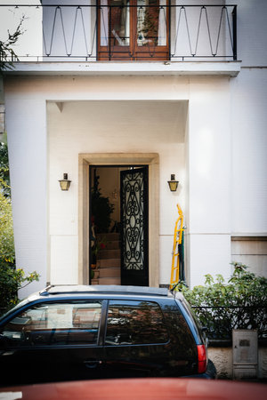 Charming home welcomes with open door and balcony viewsの写真素材