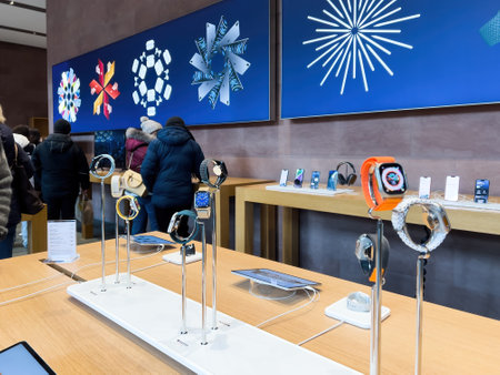 Adults Seniors Shopping for Home Tech at Apple Store During Winter Holiday.のeditorial素材