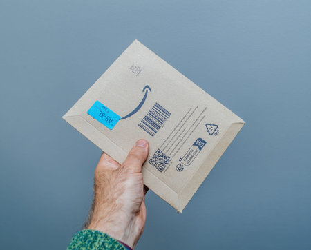 A Secure Delivery: Hand Holding a Amazon Prime Parcel.