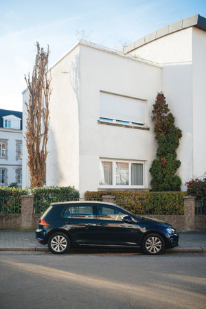 City view with VW Golf german car parked outside buildingのeditorial素材