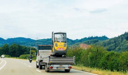 German highway with construction vehicles and trafficのeditorial素材