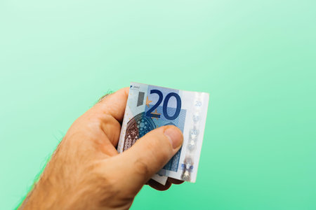 Giving 20 Euro Note in Hand