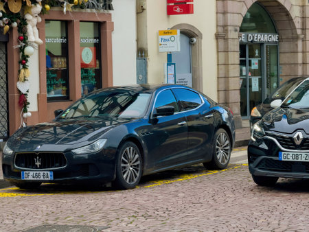 Obernai, France - Dec 26, 2023: Obernay city during the Christmas season, adorned with Maserati and Renault cars adding elegance and style to the streets.のeditorial素材