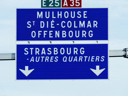 A highway sign indicates directions to Mulhouse, St-Die-Colmar, Offenburg, and Strasbourg, along with other destinations, on the E25 and A35 highways, facilitating smooth navigationの写真素材