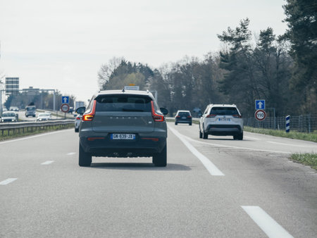 France - Mar 20, 2024:A rear view captures a Volvo SUV cruising along a French highway, its sleek...