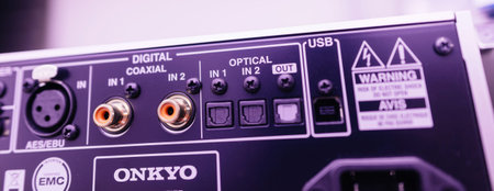 Paris, France - Jun 3, 2024: Purple color cast over all the digital AES/EBU, coaxial, optical, and...