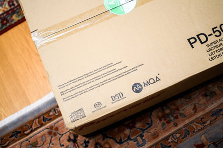 Paris, France - Aug 1, 2024: Compact disk, super audio CD, DSD, and MQA inscription on the cardboard box of a luxury Pioneer PD-50 AE super audio CD player during the unboxing processのeditorial素材