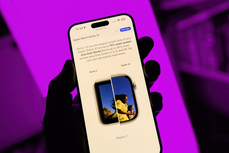 Paris, France - Sep 8, 2024: Male hand holding the iPhone 16 Pro Max displaying the comparison of...