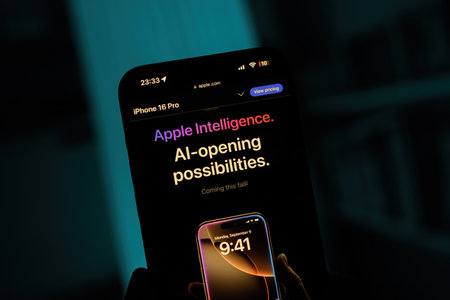 Paris, France - Sep 8, 2024: Vertical shot of a male hand holding the iPhone 16 Pro Max with a blue background, showcasing the Apple Intelligence: AI-Opening Possibilities slogan, promoting new AI features coming this fall with iOS for iPhone 16 Pro and iのeditorial素材